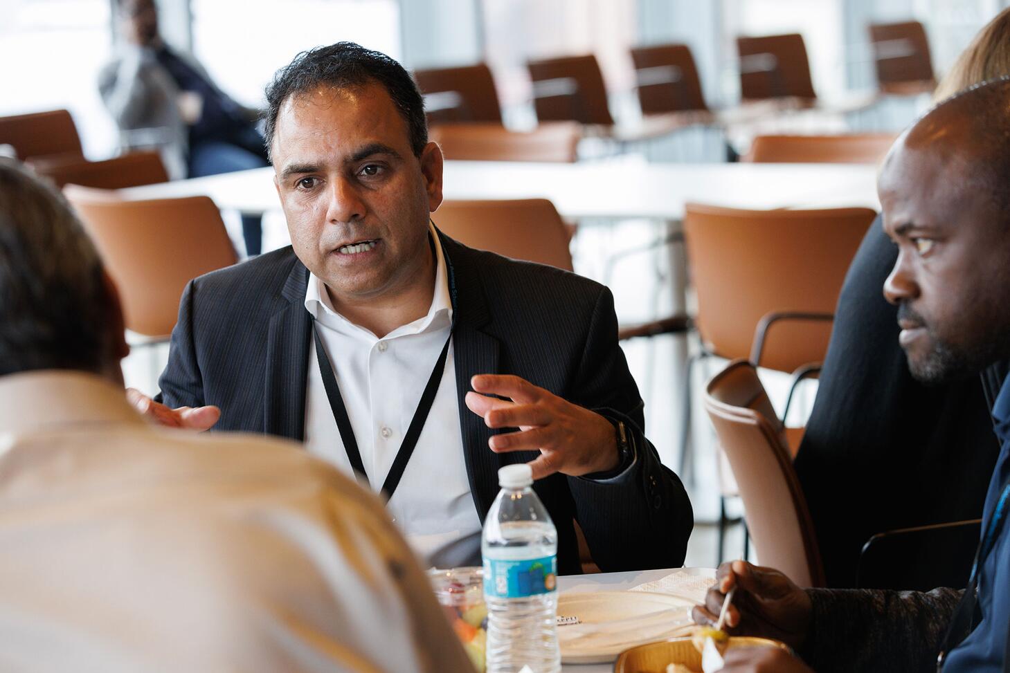 Faculty and candidates engaged in conversation