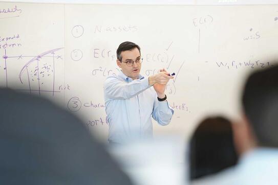Michael Johannes delivers a lecture to a room of students