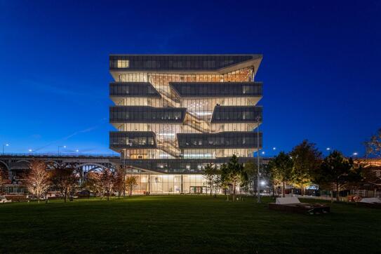 Kravis Hall at night on the Manhattanville campus of Columbia Business School.