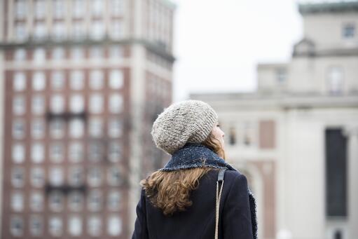 student looking onto campus