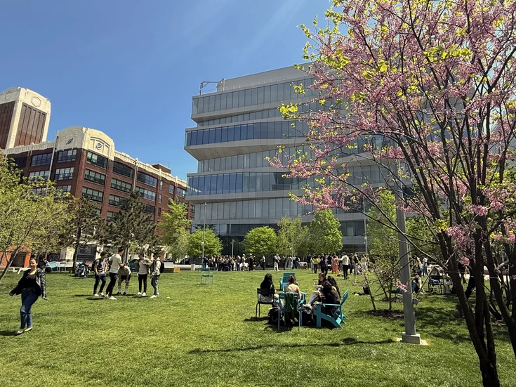 Studens outside Geffen Hall on the lawn.